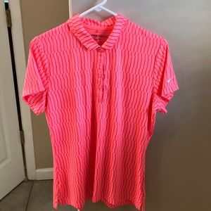 Nike size L golf shirt. Orangey/Pinkish color.